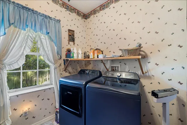 a bathroom with a double vanity sink toilet mirror and shower
