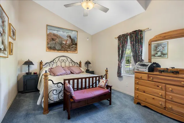 a living room with furniture a wooden floor and next to a window