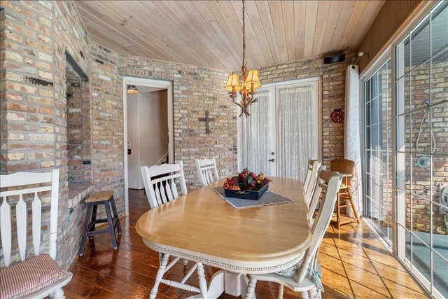a living room with furniture a flat screen tv and a window
