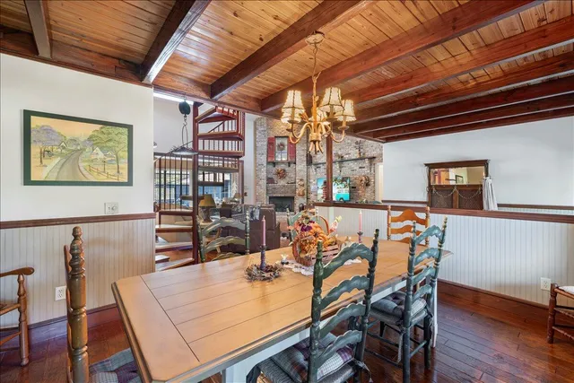 a very nice looking dining room with furniture