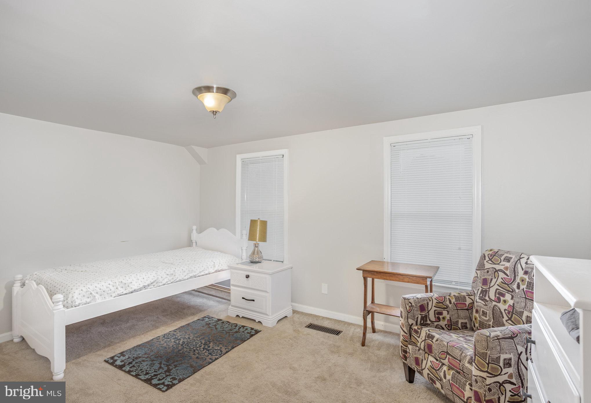 77 Petersburg Road Lancaster, PA 17601 - Photo 15 of 28 a bedroom with a bed and a couch