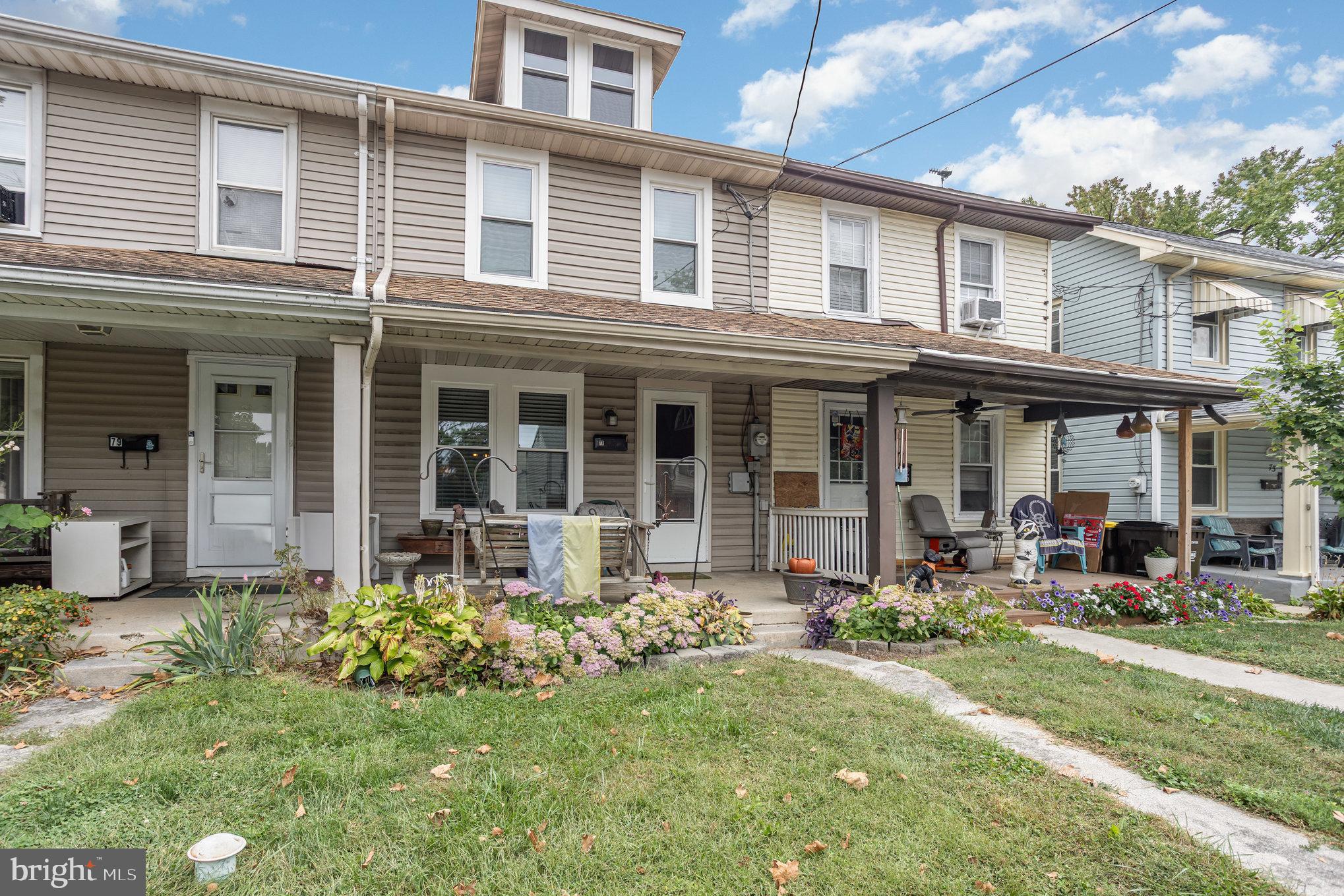 77 Petersburg Road Lancaster, PA 17601 - Photo 2 of 28 a front view of a house with a garden and porch