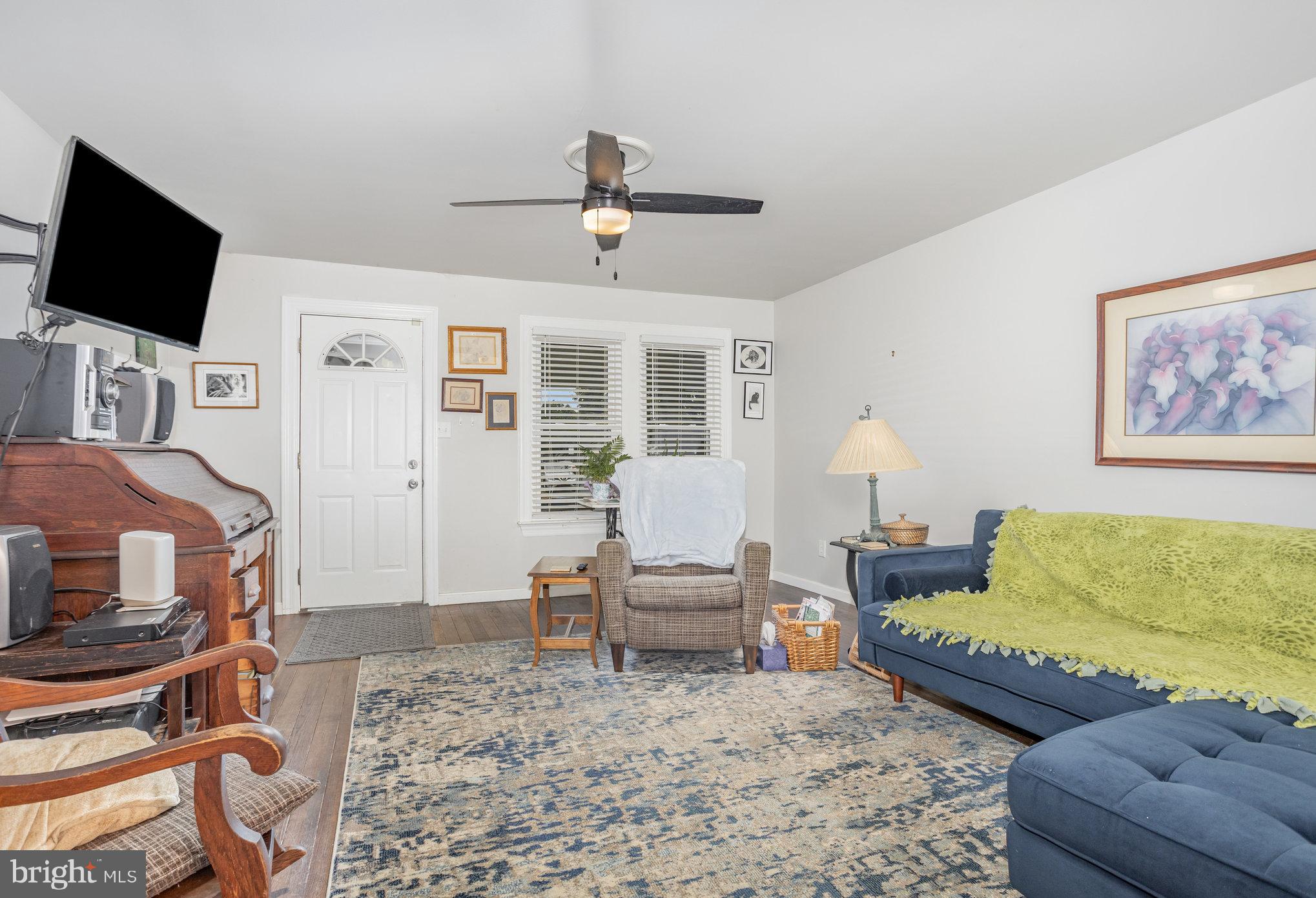 77 Petersburg Road Lancaster, PA 17601 - Photo 6 of 28 a living room with furniture and a flat screen tv