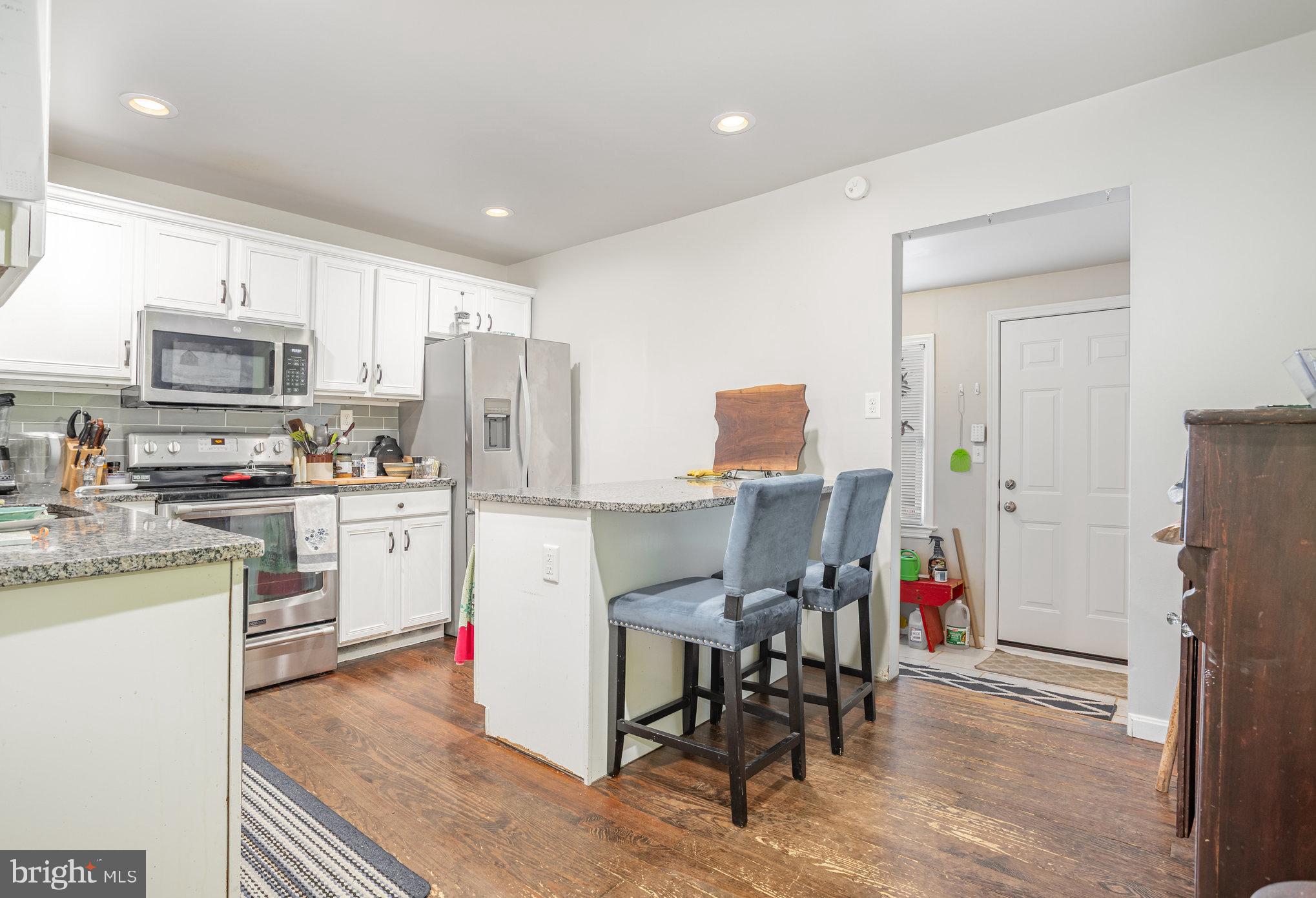 77 Petersburg Road Lancaster, PA 17601 - Photo 9 of 28 a kitchen with white cabinets and stainless steel appliances