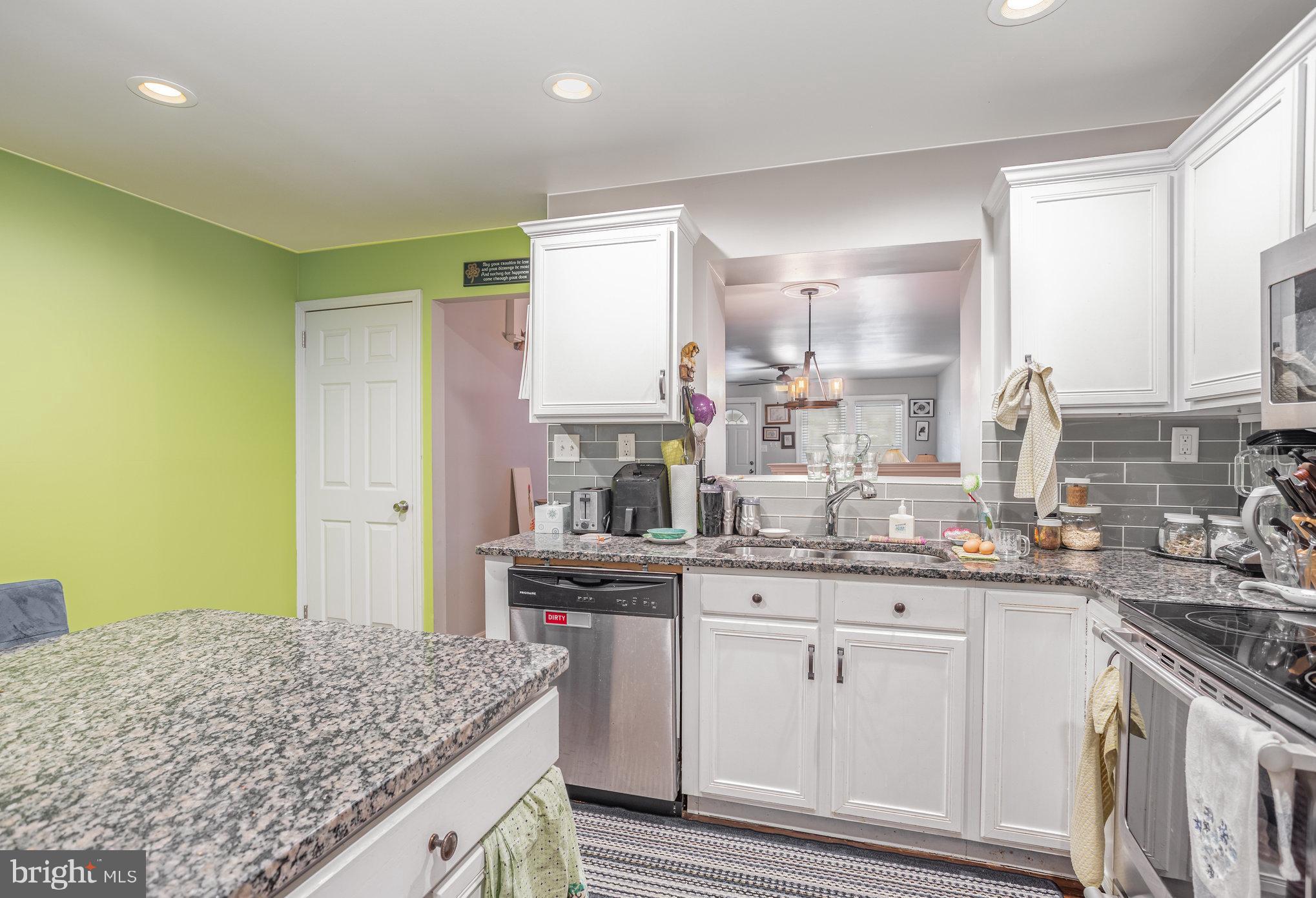 77 Petersburg Road Lancaster, PA 17601 - Photo 10 of 28 a kitchen with a sink stove and cabinets