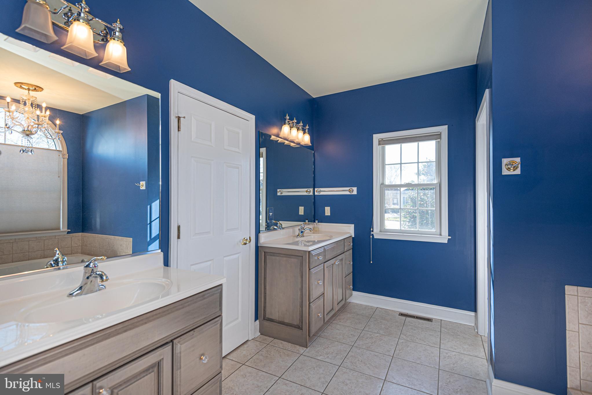 6023 Tarry Town Road Salisbury, MD 21801 - Photo 22 of 61 Elegant blue-hued bathroom retreat.