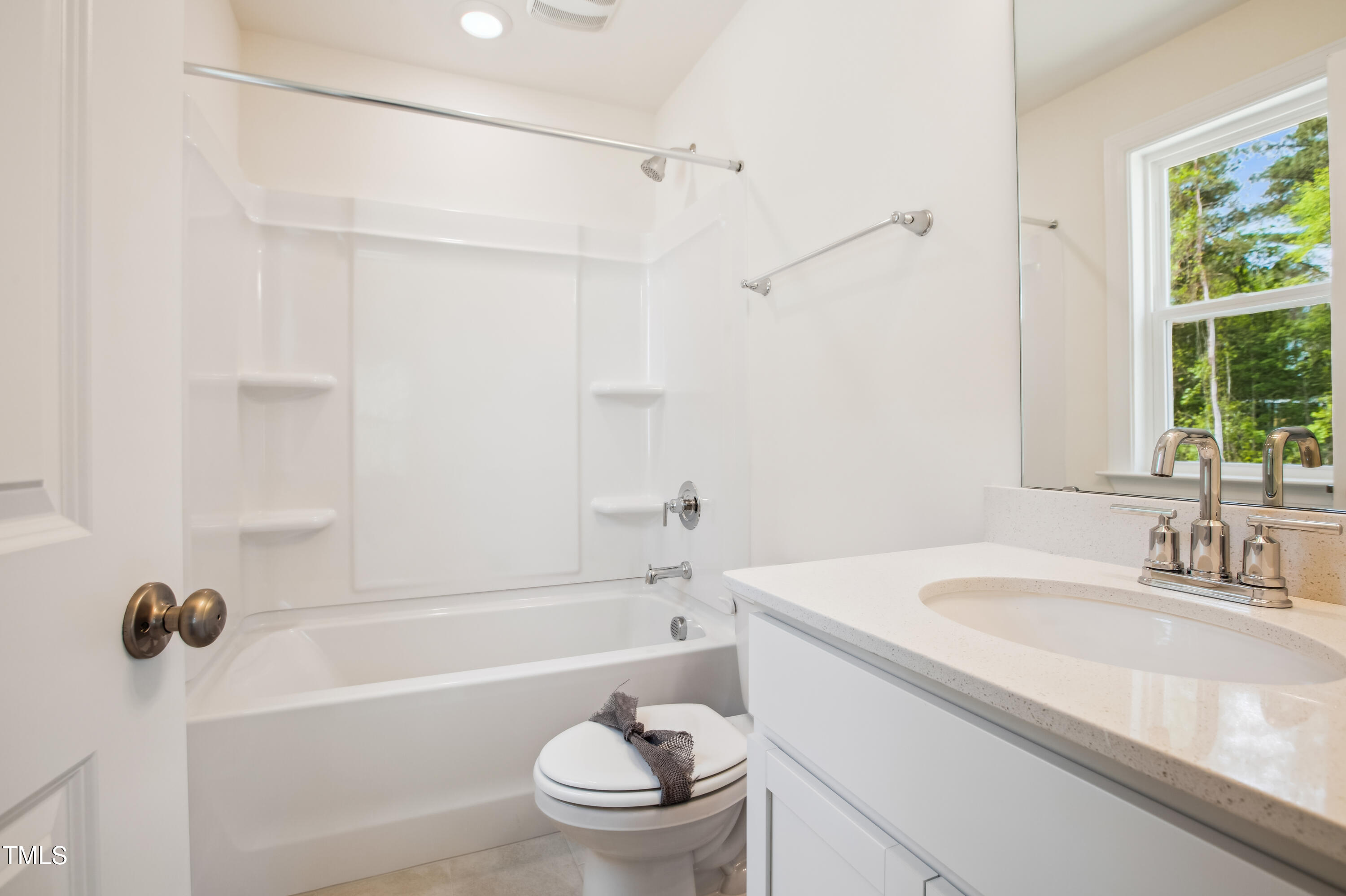 73 Artic Circle Garner, NC 27529 - Photo 24 of 39 a bathroom with a sink a toilet and a bathtub