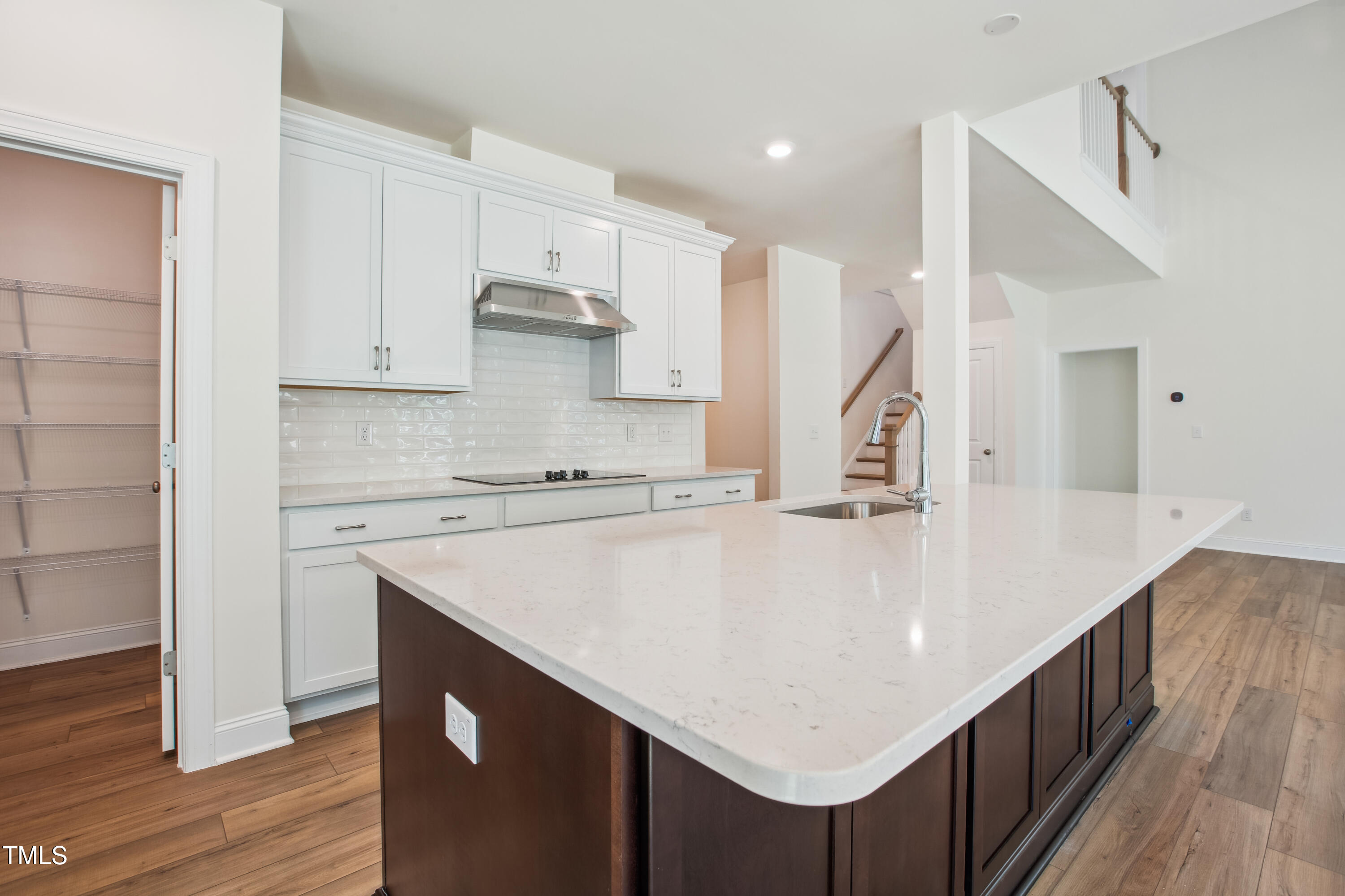 73 Artic Circle Garner, NC 27529 - Photo 6 of 39 a kitchen with kitchen island wooden cabinets and white appliances