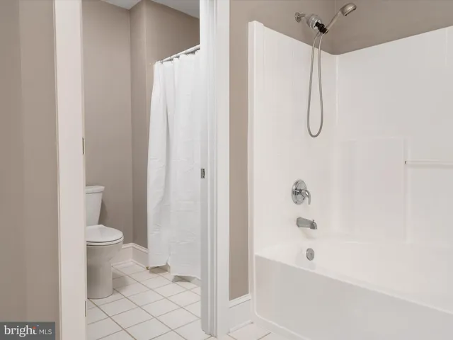 a bedroom with a bed and a table