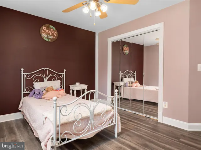 a living room with a baby crib furniture and a window