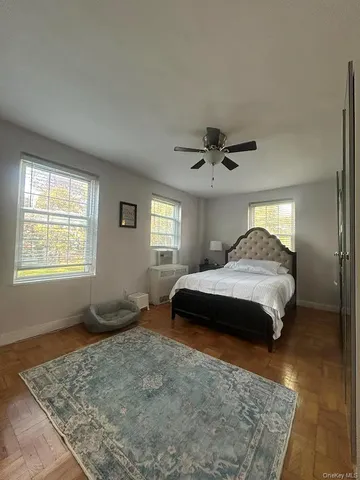 a bed room with furniture and a window