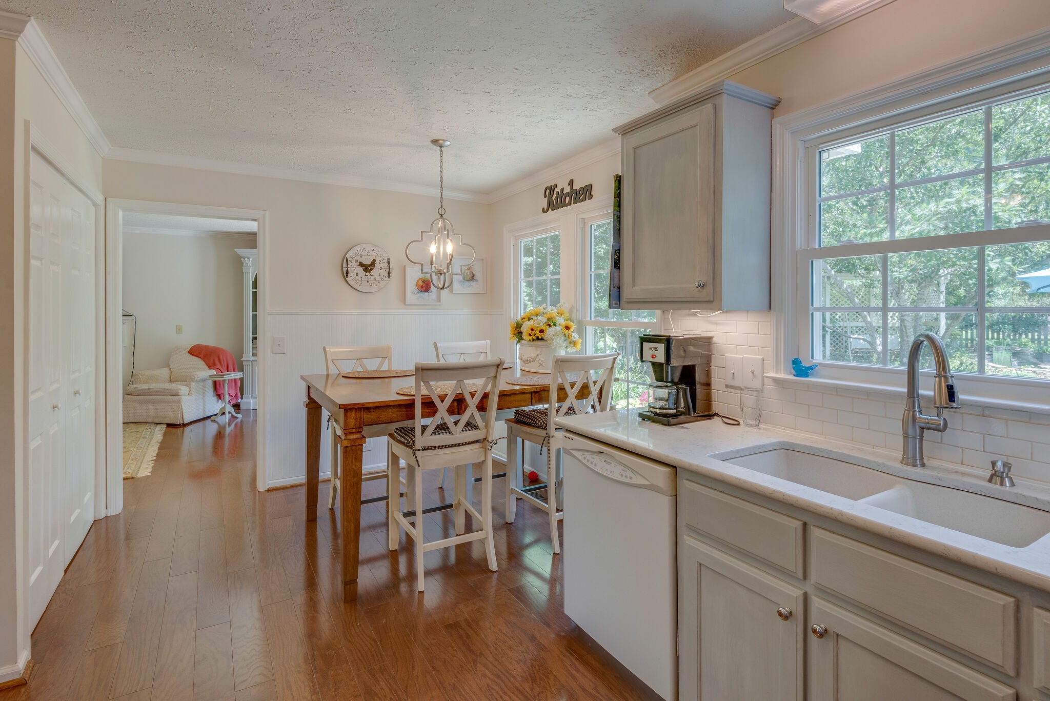 283 Eastside Road Burns, TN 37029 - Photo 8 of 28 a kitchen with a sink cabinets and wooden floor