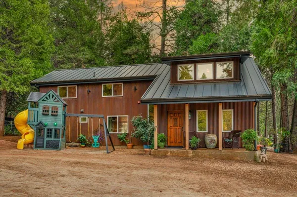 a front view of a house with a yard