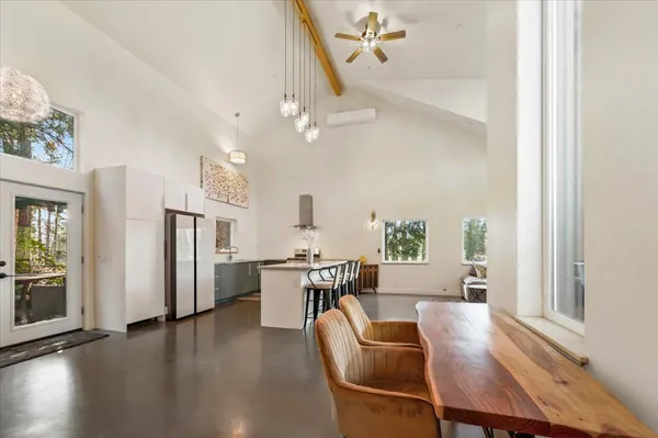 a view of a livingroom with furniture and windows