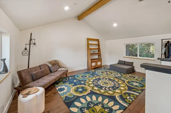 a bedroom with a bed and a couch