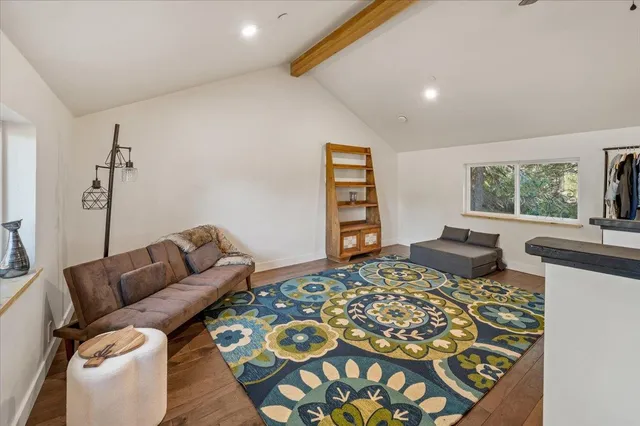 a bedroom with a bed and a couch