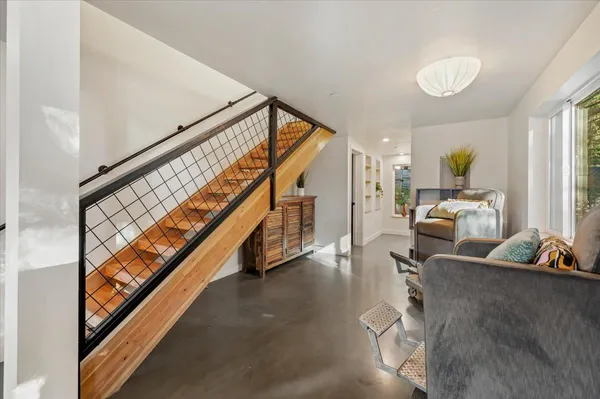 a room with gym equipment and windows