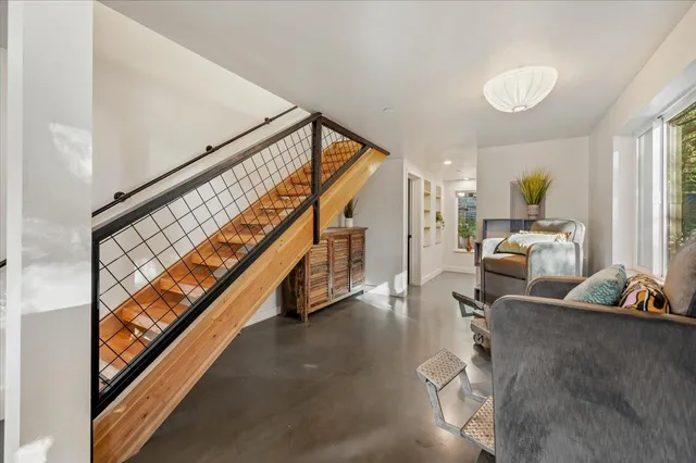 a room with gym equipment and windows