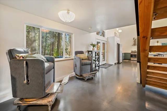 a view of an entryway with wooden floor