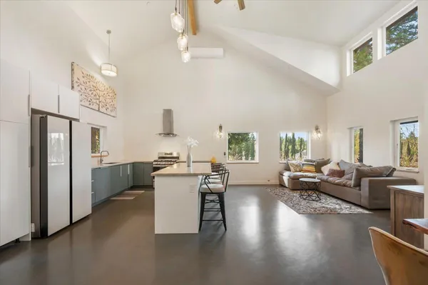a kitchen with stainless steel appliances a sink and a refrigerator
