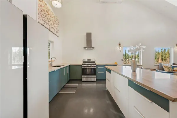 a view of living room with furniture and wooden floor