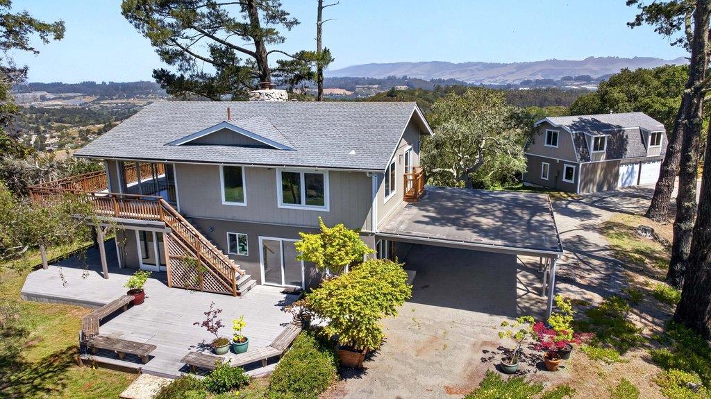 505 Hidden Valley Road Watsonville, CA 95076 - Photo 2 of 72 a front view of a house with a yard and mountain view in back