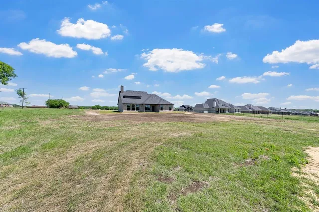 a view of a house with a big yard