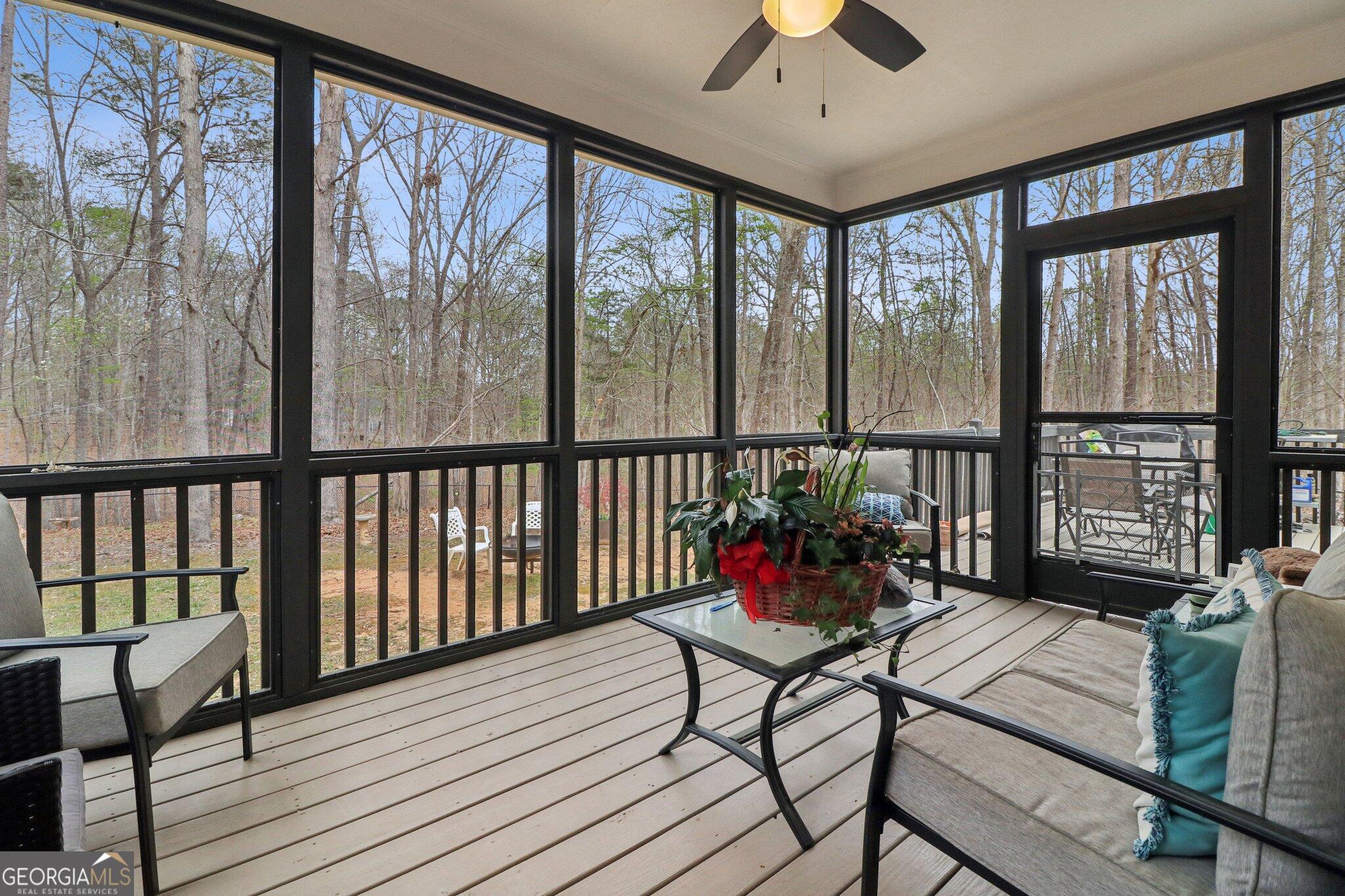 3792 Falls Trail Winston, GA 30187 - Photo 24 of 24 a living room filled with furniture and a floor to ceiling window