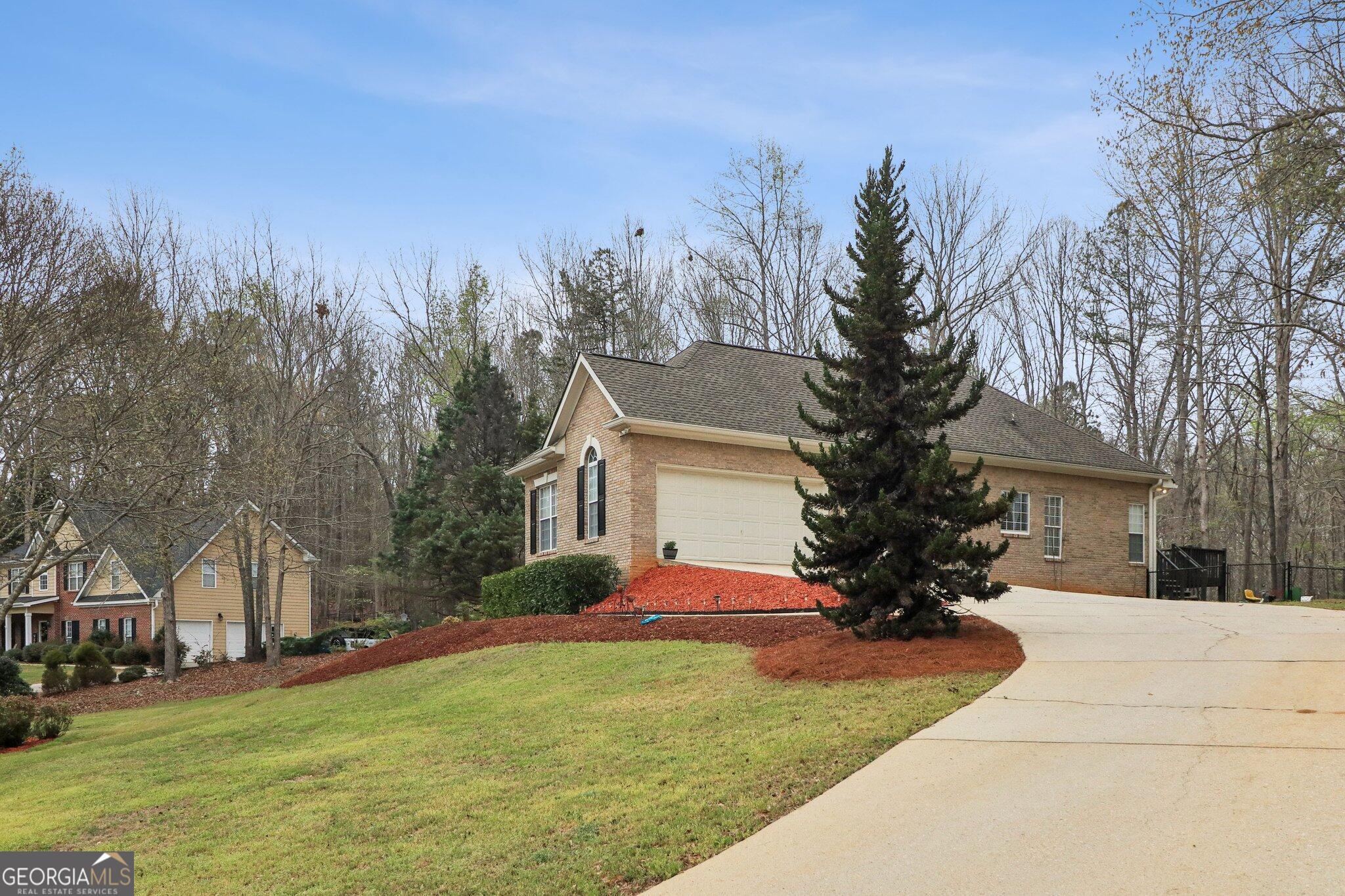 3792 Falls Trail Winston, GA 30187 - Photo 4 of 24 a front view of house with yard and trees around