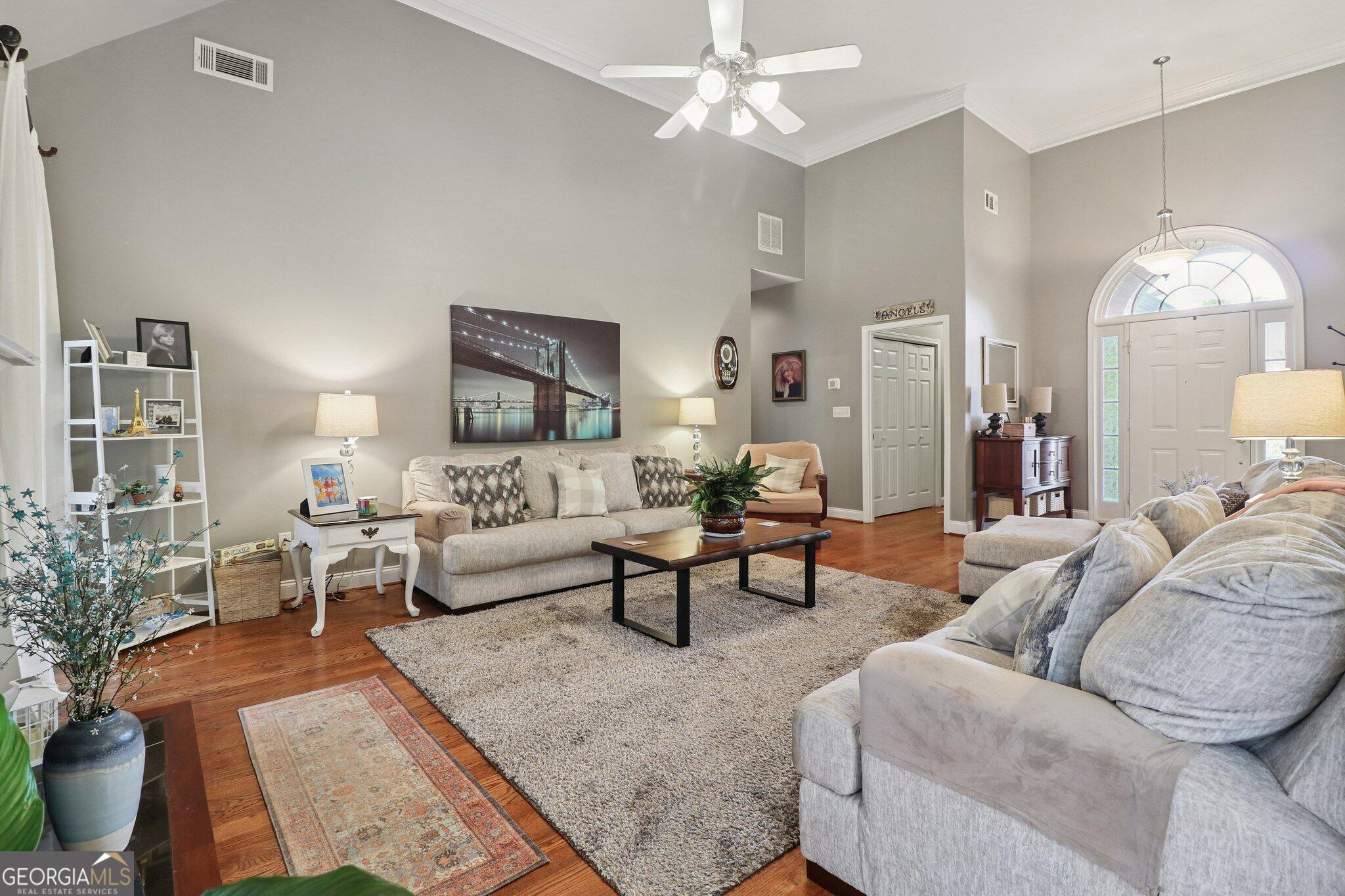 3792 Falls Trail Winston, GA 30187 - Photo 9 of 24 a living room with furniture potted plant and a chandelier