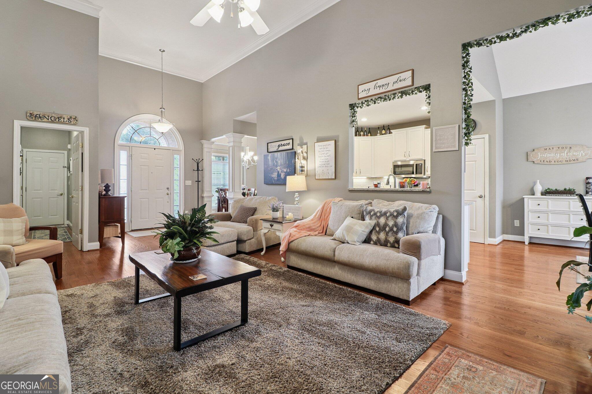 3792 Falls Trail Winston, GA 30187 - Photo 10 of 24 a living room with furniture and a chandelier