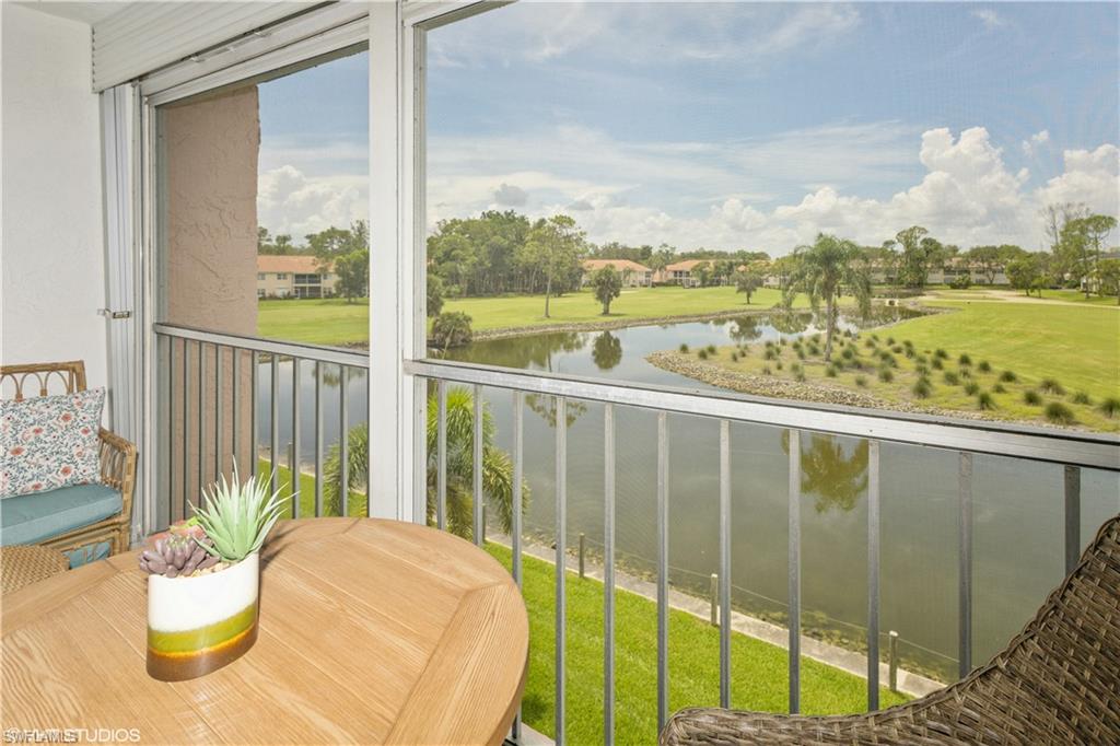 190 Turtle Lake Court, Unit 311 Naples, FL 34105 - Photo 29 of 47 a view of a balcony with lake view and mountain view