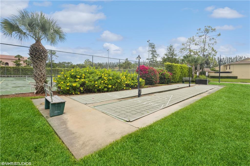 190 Turtle Lake Court, Unit 311 Naples, FL 34105 - Photo 35 of 47 a view of a garden