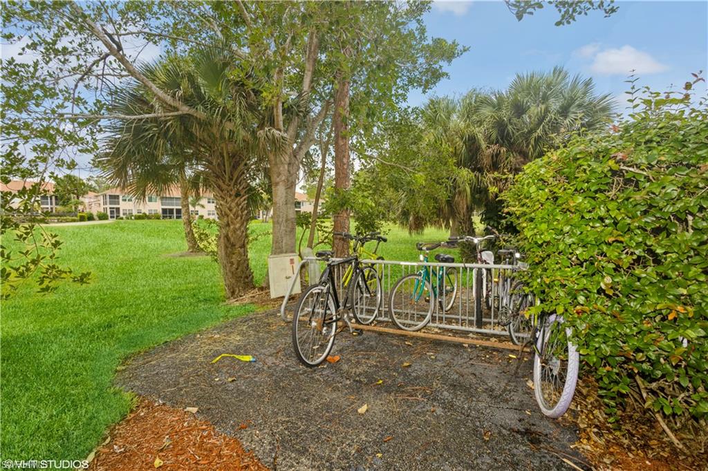 190 Turtle Lake Court, Unit 311 Naples, FL 34105 - Photo 42 of 47 a view of a yard with a slide