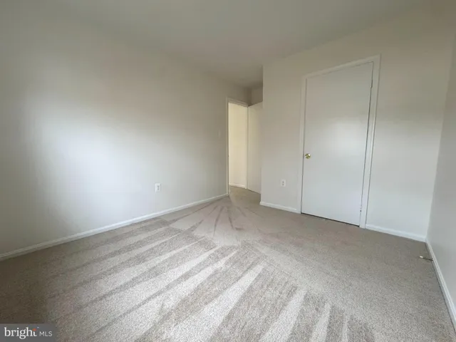 a view of an empty room and a window