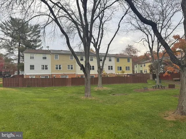 a view of backyard with seating and green space