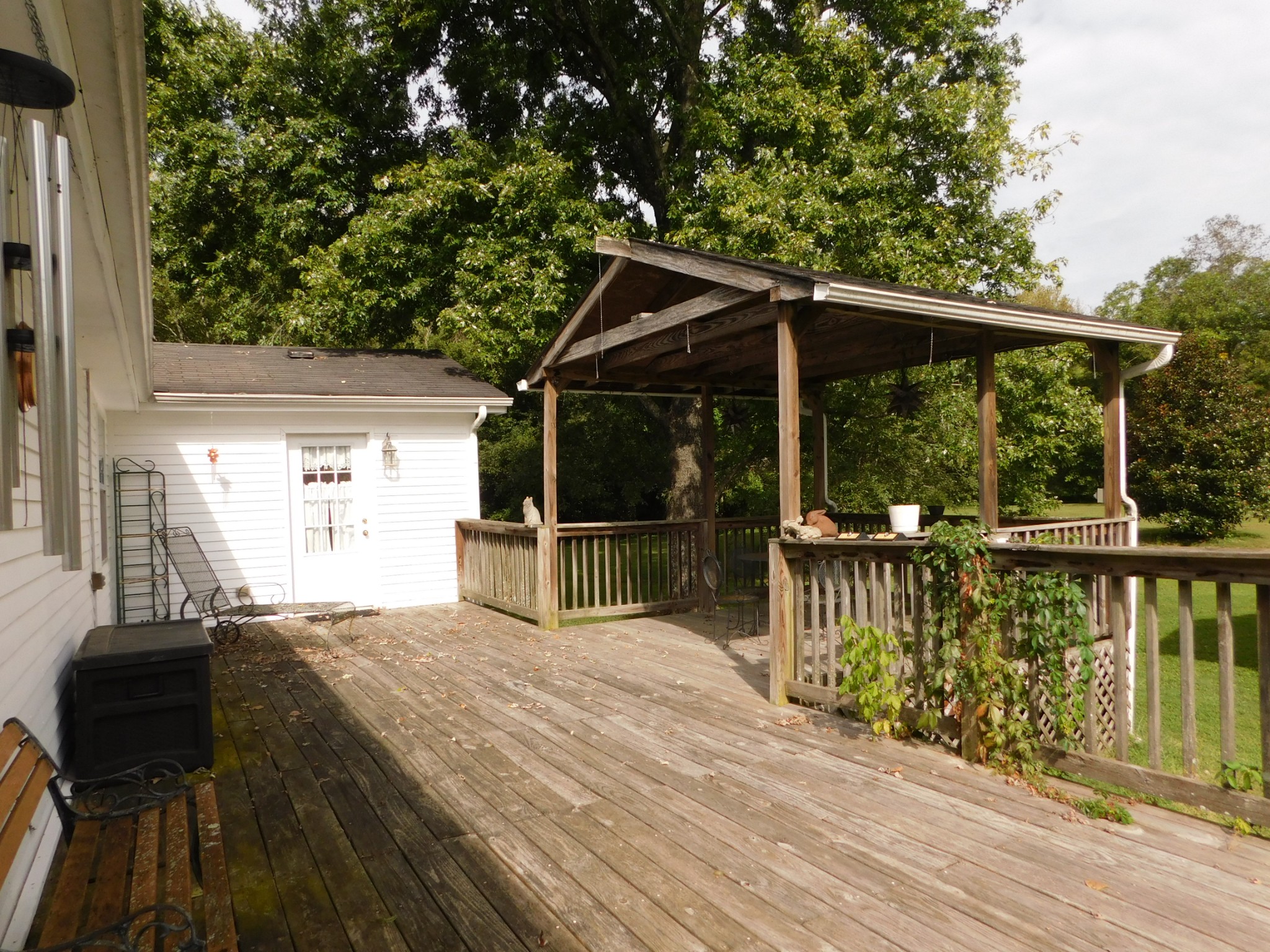 696 Baker Road Columbia, TN 38401 - Photo 14 of 19 a view of a patio with a table chairs and a floor to ceiling window