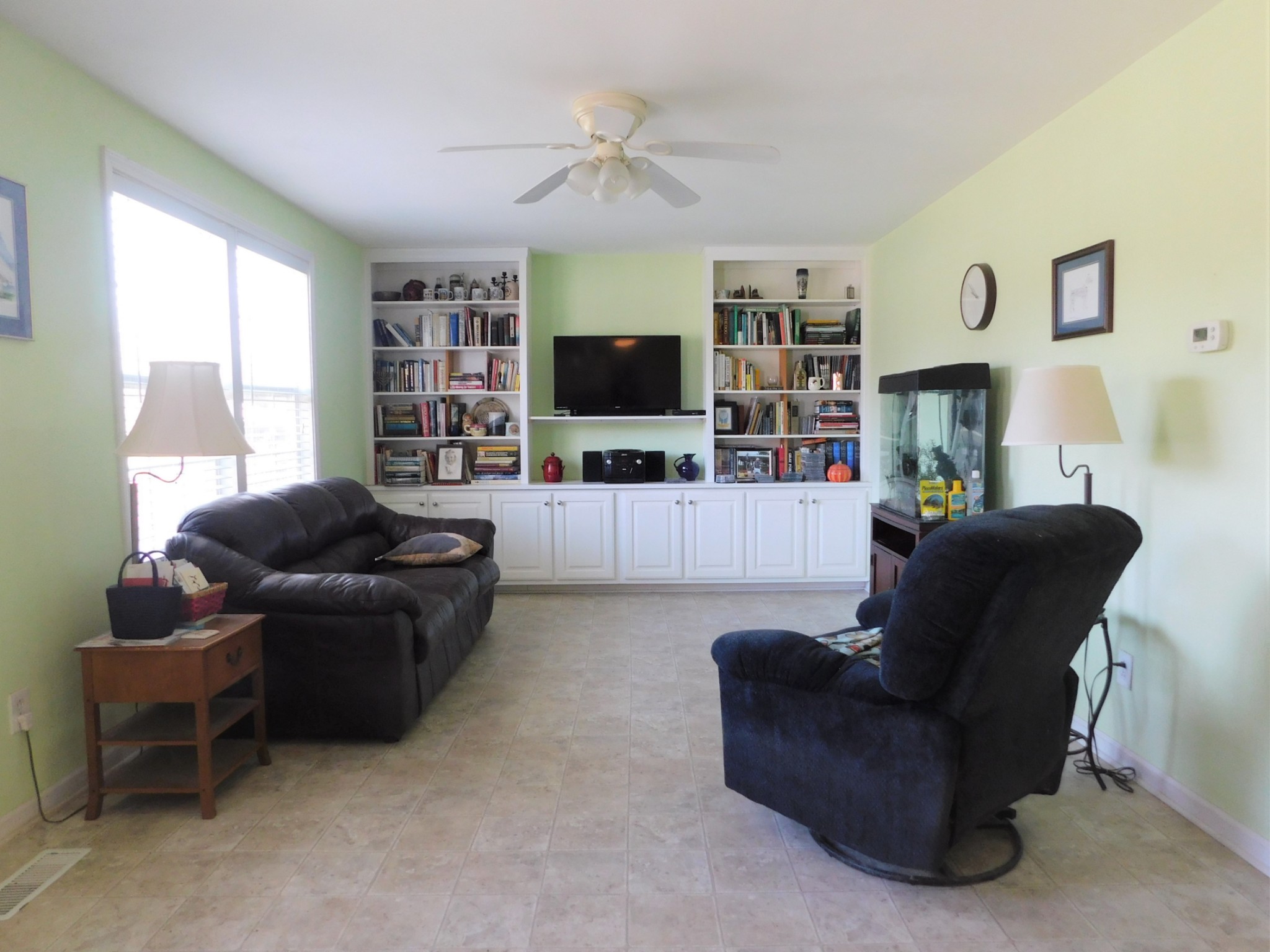 696 Baker Road Columbia, TN 38401 - Photo 3 of 19 a living room with furniture and a flat screen tv