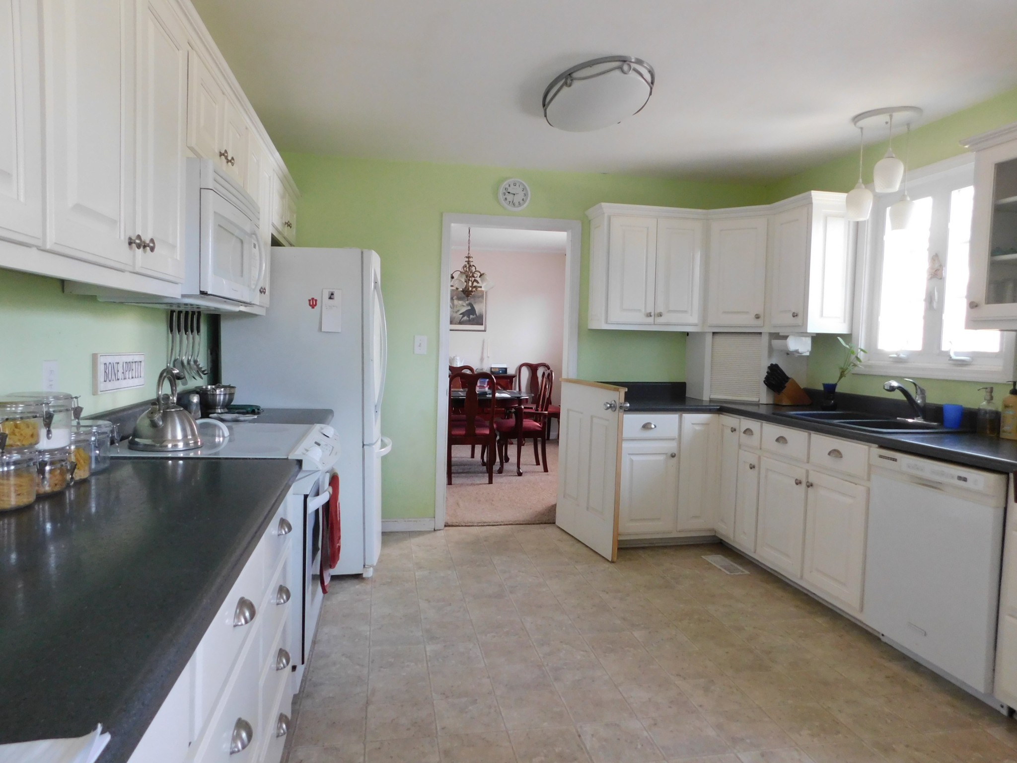 696 Baker Road Columbia, TN 38401 - Photo 5 of 19 a kitchen with a refrigerator and a stove top oven