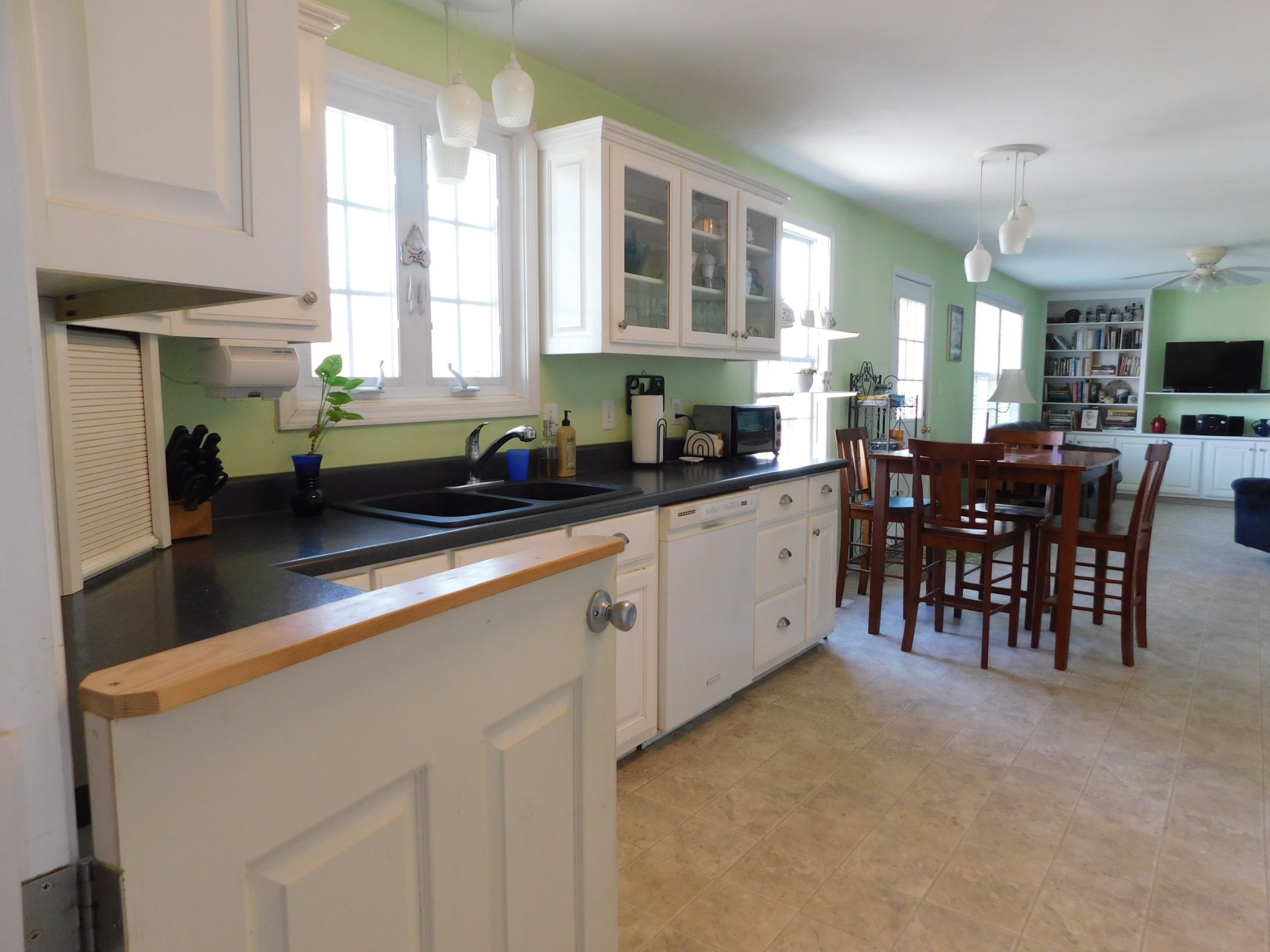 696 Baker Road Columbia, TN 38401 - Photo 6 of 19 a kitchen with stainless steel appliances granite countertop sink a table and chairs in it