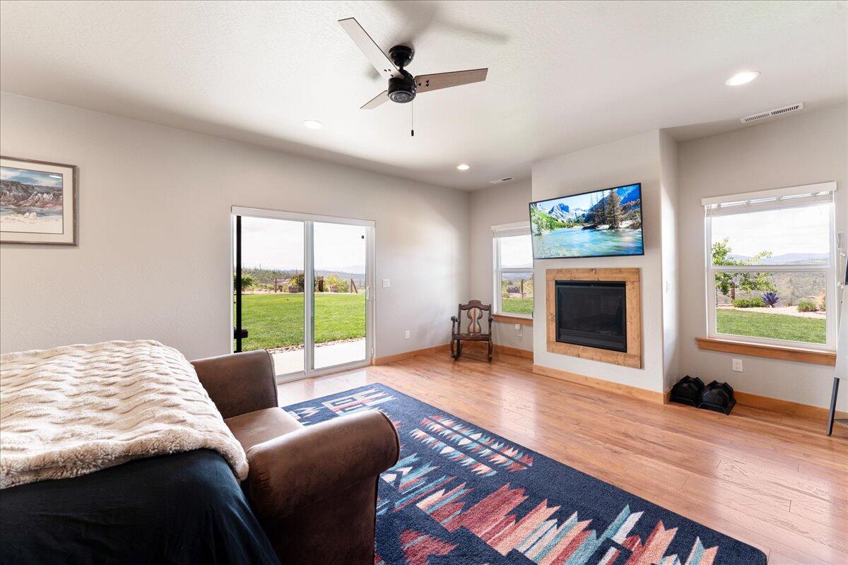 2220 Butte Falls Highway Eagle Point, OR 97524 - Photo 23 of 69 a living room with furniture a fireplace and a flat screen tv