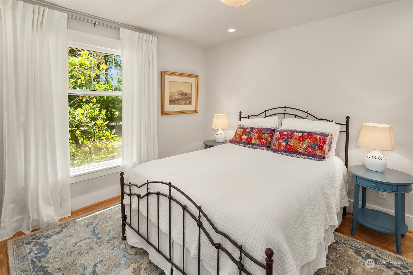 10810 Southwest Bank Road Vashon, WA 98070 - Photo 17 of 34 a bedroom with a bed and a table