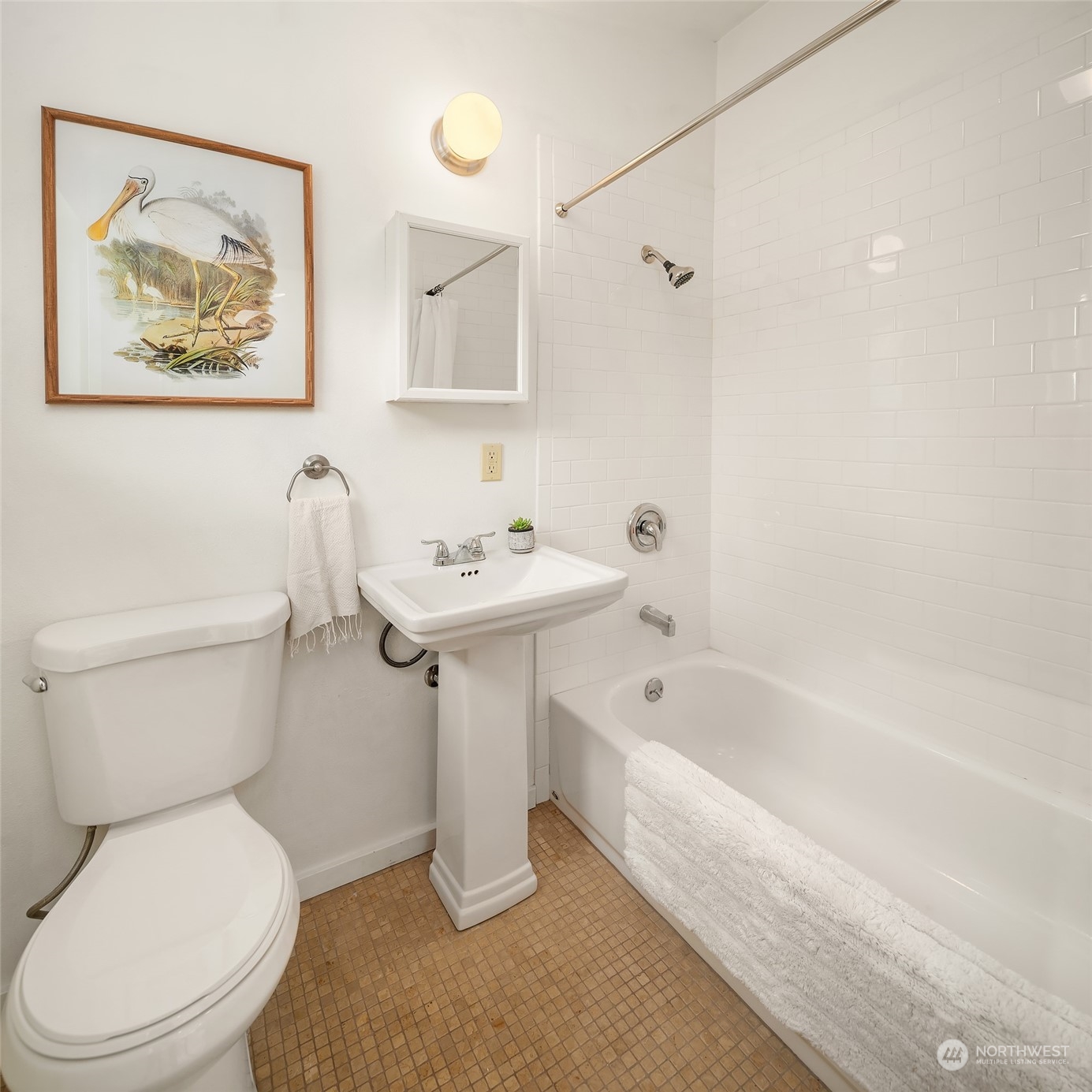 10810 Southwest Bank Road Vashon, WA 98070 - Photo 21 of 34 a white toilet sitting next to a bathroom sink and tub
