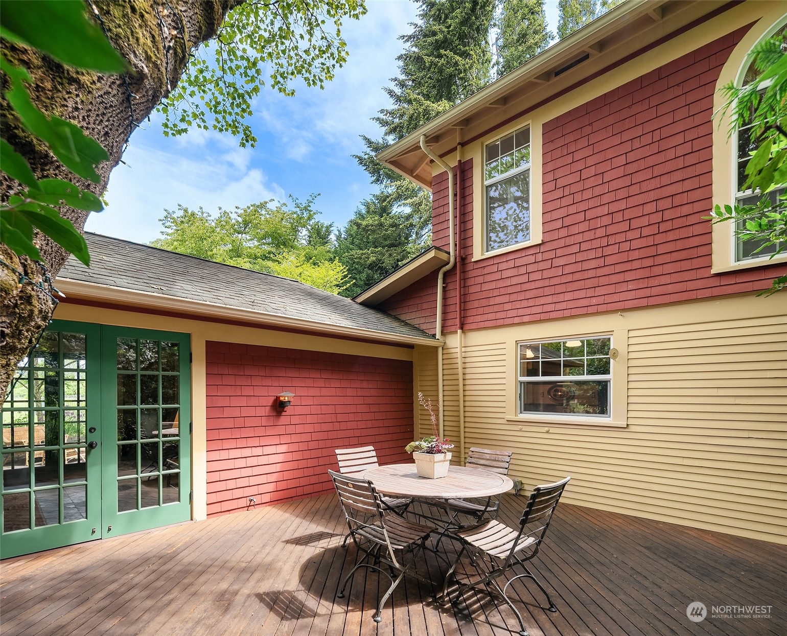 10810 Southwest Bank Road Vashon, WA 98070 - Photo 23 of 34 a view of a wooden chairs and table in the patio