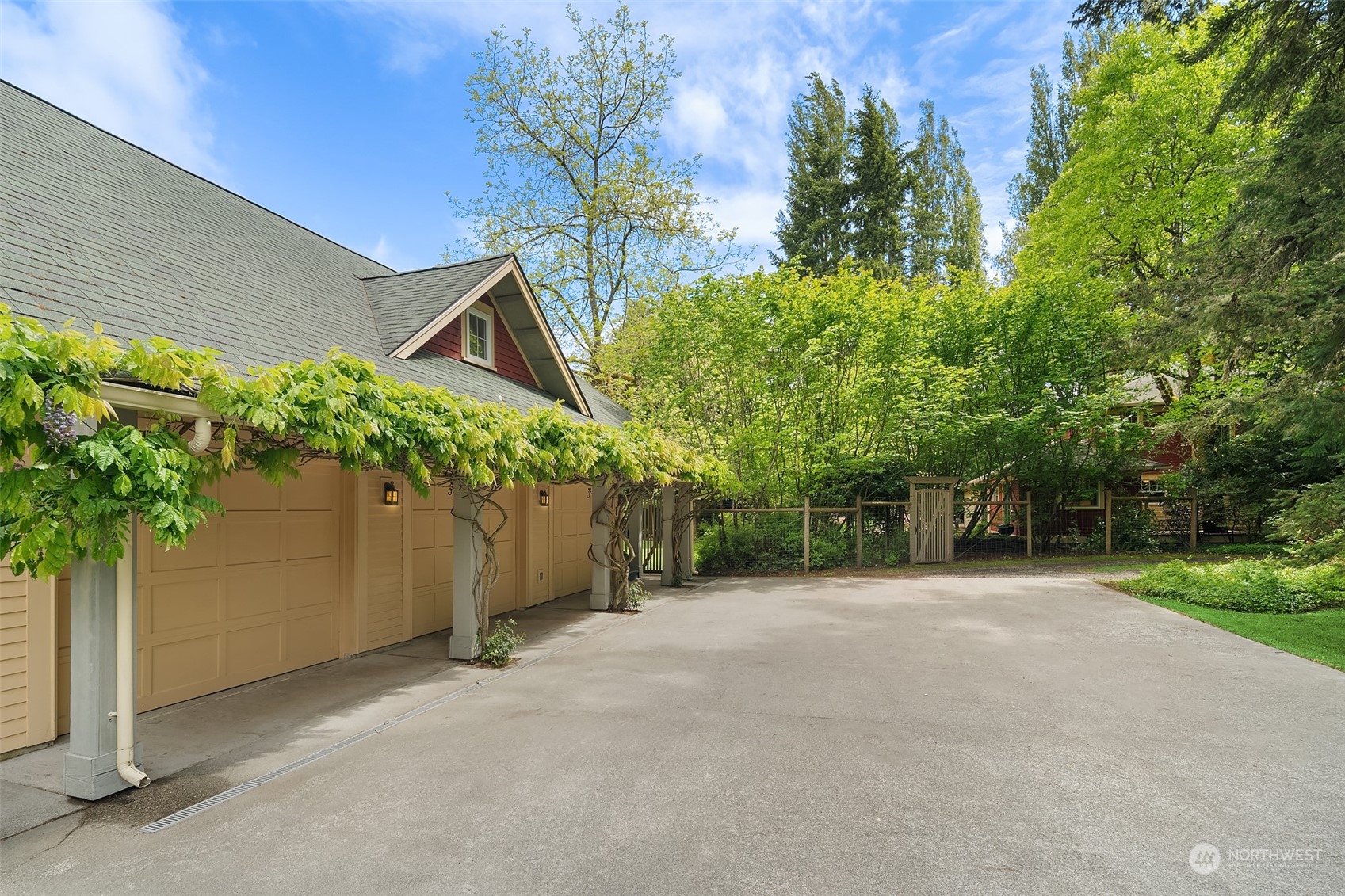 10810 Southwest Bank Road Vashon, WA 98070 - Photo 24 of 34 a view of a house with a tree and a yard