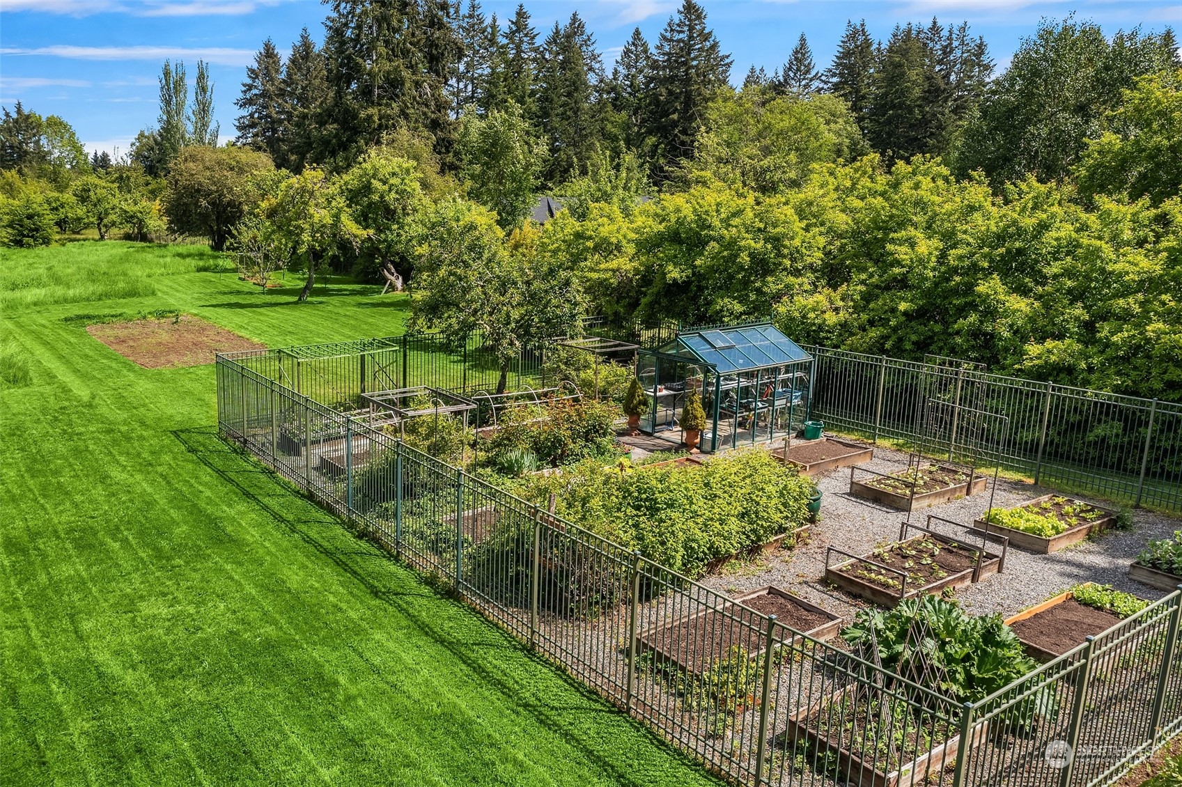 10810 Southwest Bank Road Vashon, WA 98070 - Photo 26 of 34 a view of a house with a yard