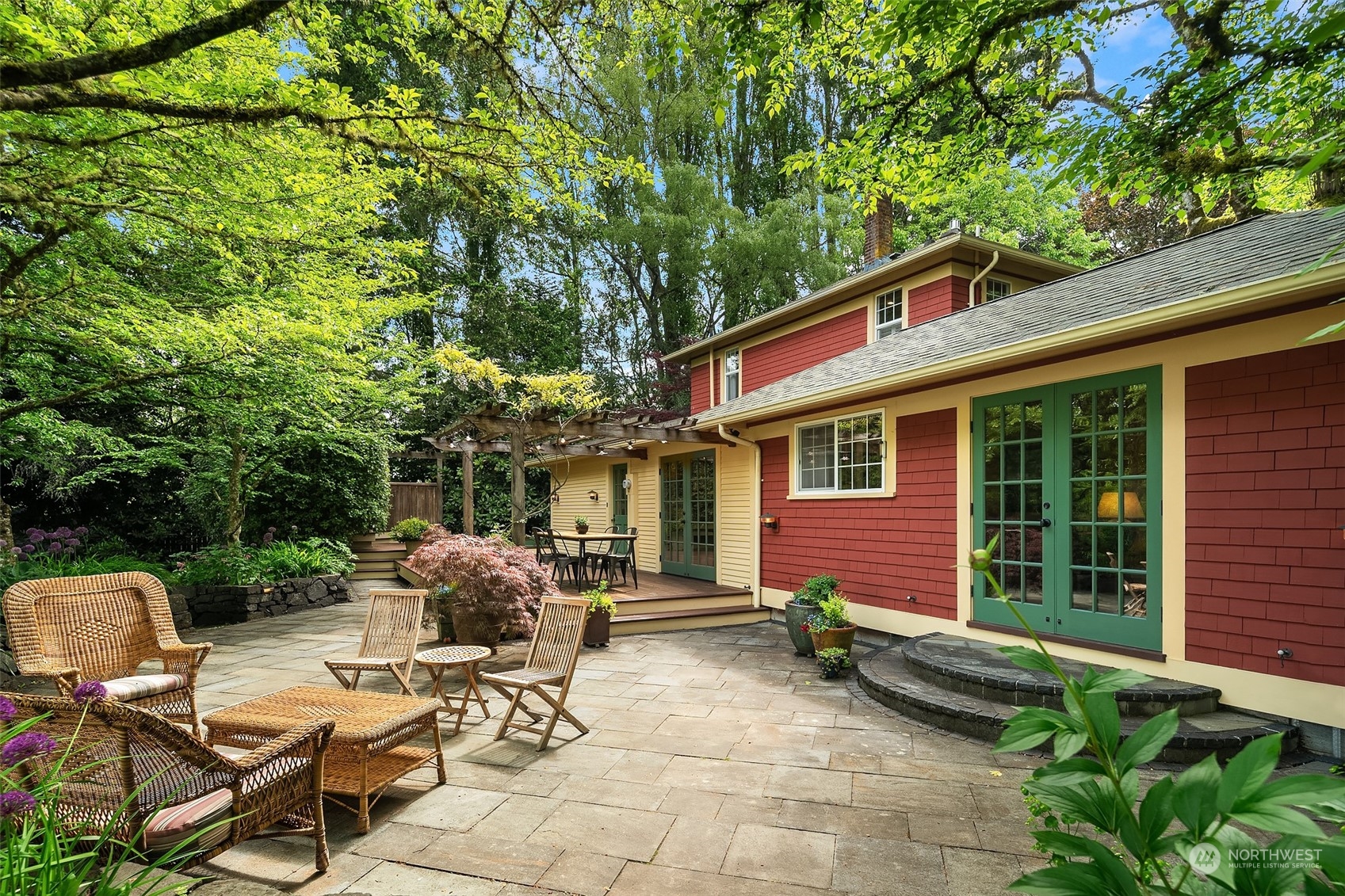 10810 Southwest Bank Road Vashon, WA 98070 - Photo 31 of 34 a view of backyard with table and chairs and a large tree