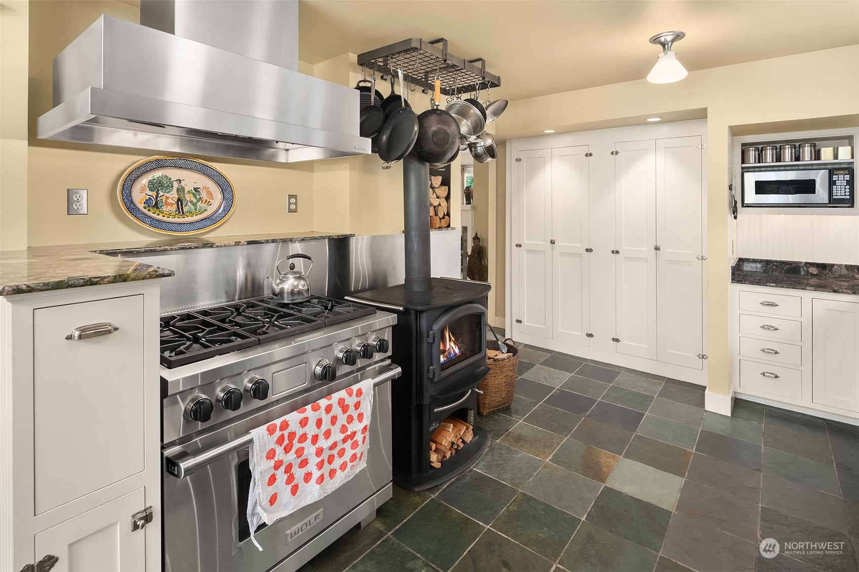 10810 Southwest Bank Road Vashon, WA 98070 - Photo 5 of 34 a kitchen with a stove and cabinets