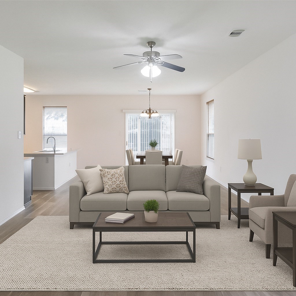 a living room with furniture and a chandelier