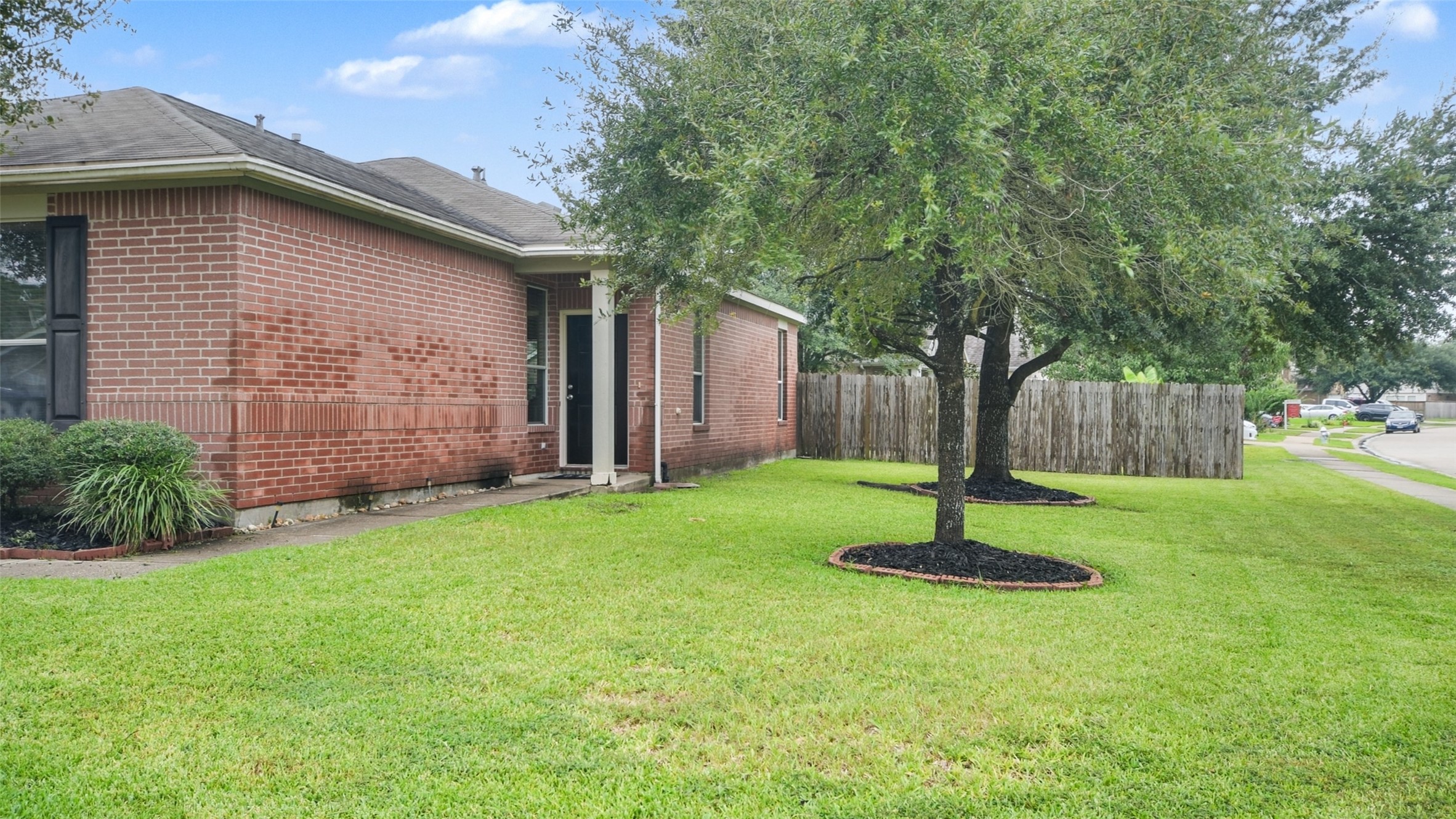 18206 West Ridge Bend Lane Cypress, TX 77433 - Photo 11 of 16 a backyard of a house with lots of green space